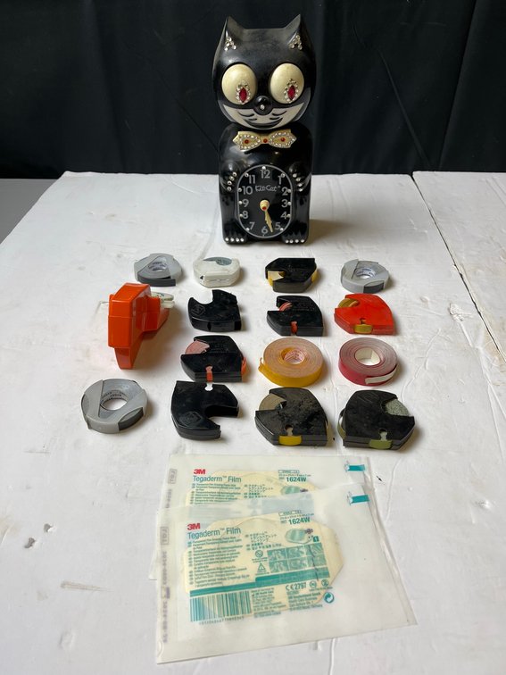 Kit-Cat Clock With Label Tape Dispensers, Tegaderm