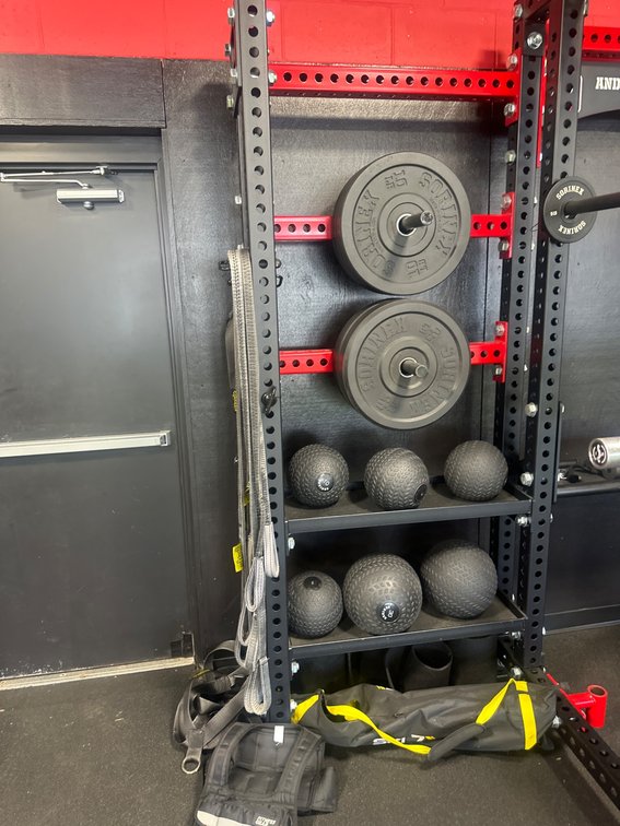 Power Rack With Weight Plates, Slam Balls, Straps, and Accessories