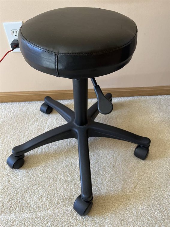 Adjustable Black Vinyl Rolling Stool