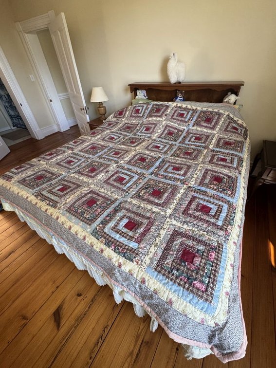 Quilt is Laying on King Bed for Size