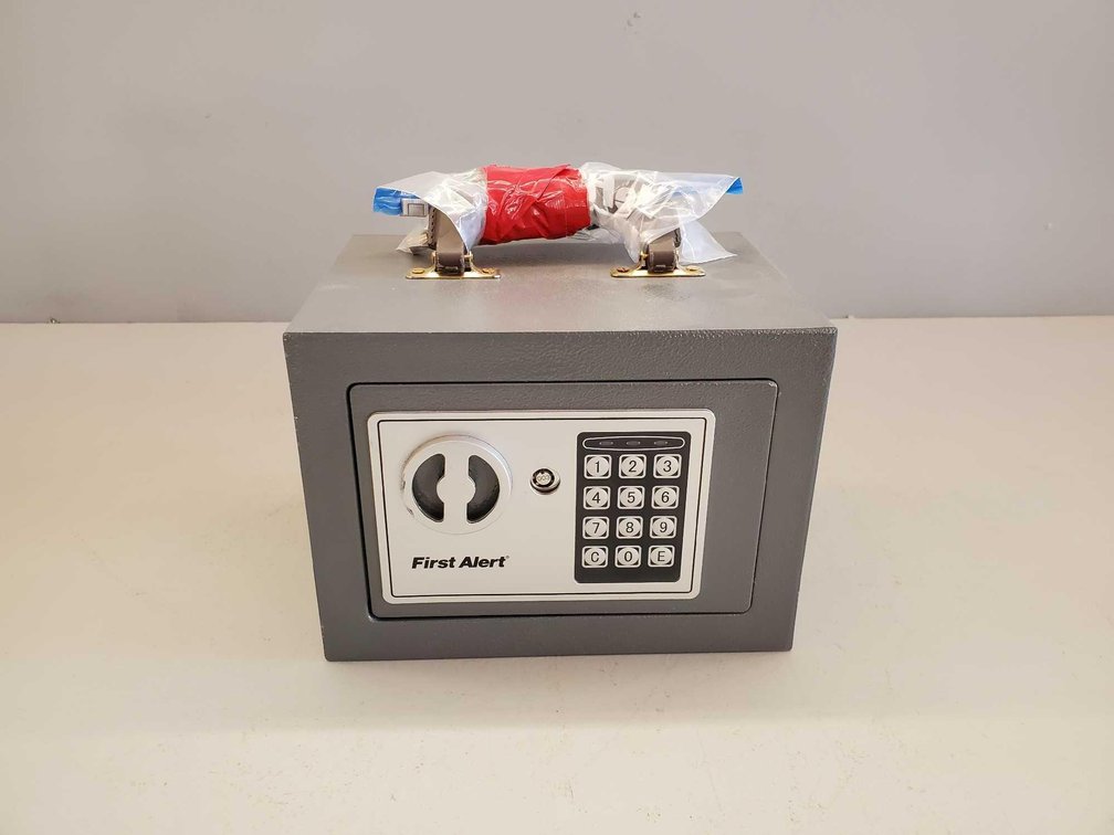(I-16) FIRST ALERT SMALL SAFE WITH KEY OR CODE