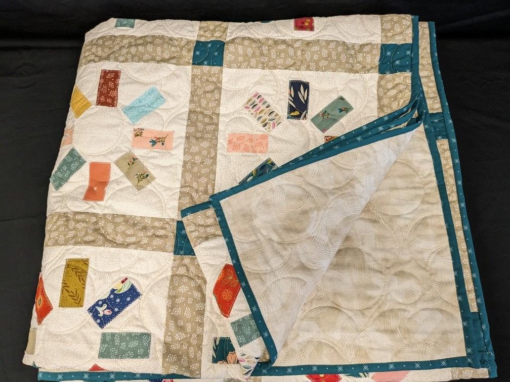 HOMEMADE QUILT DONATED BY LORI KASELLA AND SALLY WALTMAN. 8' X 7' QUEEN SIZE QUILT