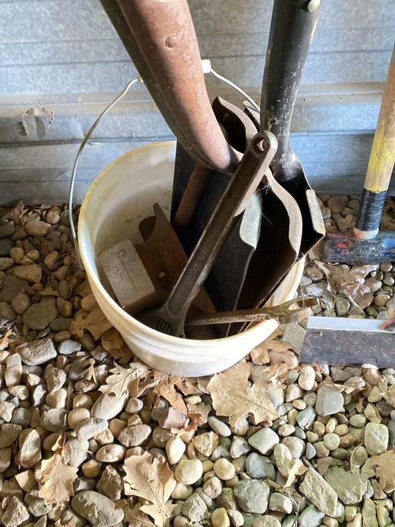 BUCKET OF SHOVEL HEADS AND WRENCHES