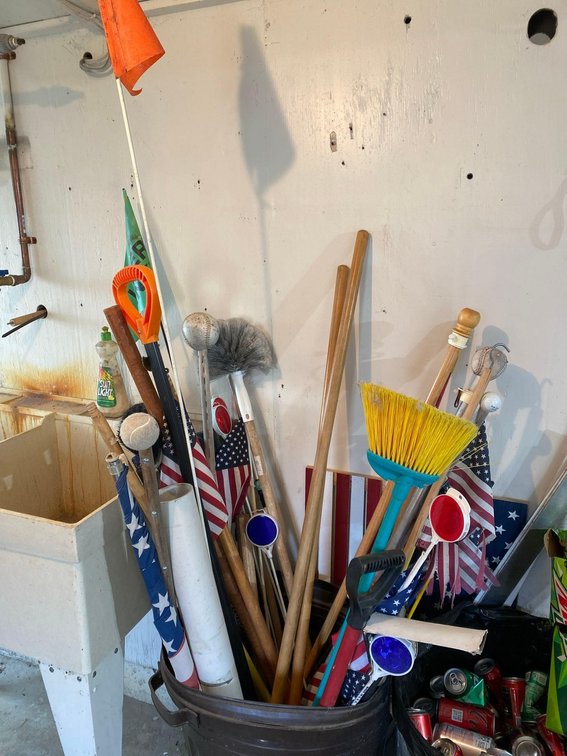 ASSORTMENT OF TOOL HANDLES, REFLECTORS, US FLAGS, AND MORE