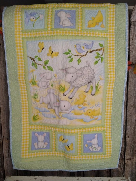 BABY QUILT #1. BLUE, GREEN, AND YELLOW. SHEEP, BUNNIES, DUCKS, AND BUTTERFLIES.