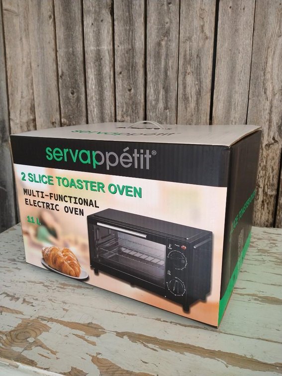 2 SLICE TOASTER OVEN. MULTI-FUNCTIONAL ELECTRIC OVEN.