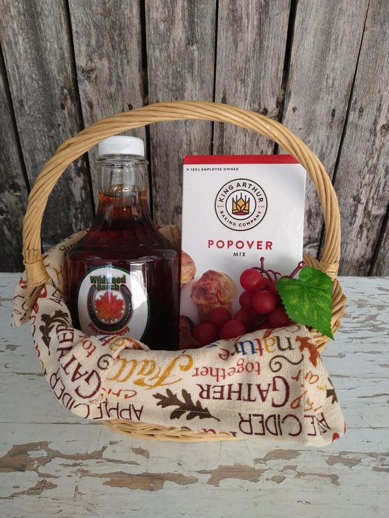 MAPLE SYRUP AND POPOVER BASKET. PURE MAPLE SYRUP, POPOVER MIX IN A BOX, KITCHEN TOWEL, ARTIFICIAL 