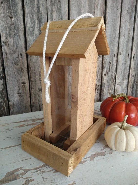 BIRD FEEDER. WOODEN BIRD FEEDER MADE BY HAND.