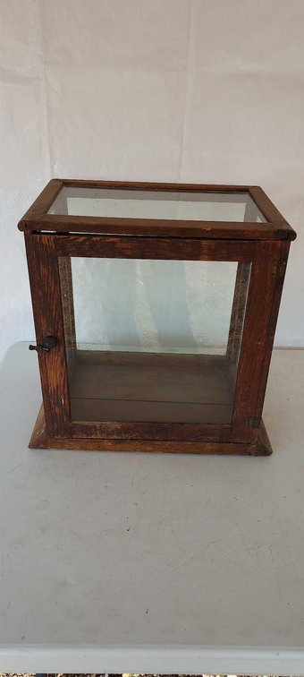 (I-38) ANTIQUE WOOD AND GLASS APOTHECARY CASE.  MISSING GLASS SHELVES