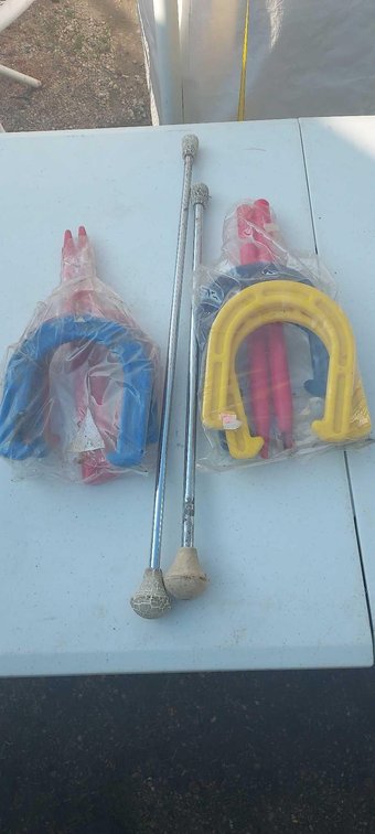 (I-57) 2 SETS OF CHILDREN'S HORSESHOE GAMES AND TWO VINTAGE TWIRLING BATONS