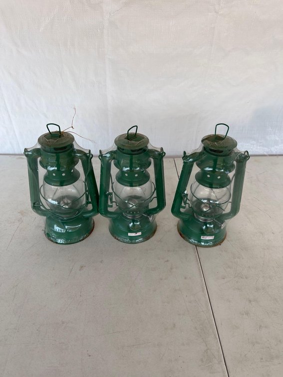 (I-62) 3 NEW, STILL WRAPPED GREEN KEROSENE LANTERNS