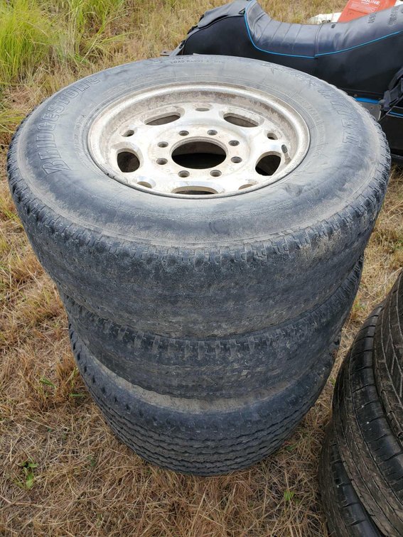 (I-64A) (4) BRIDGESTONE 245/75 R16 TIRES W/8/BOLT RIMS