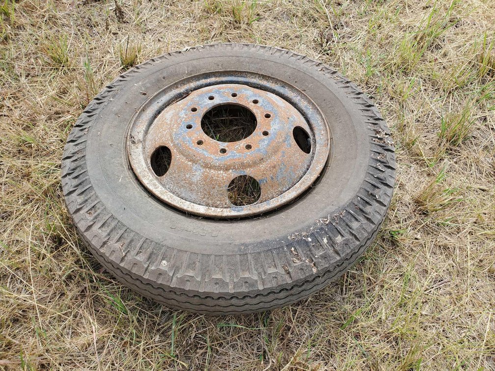 (I-82A) 8.25 - 20 TIRE ON 10 BOLT RIM