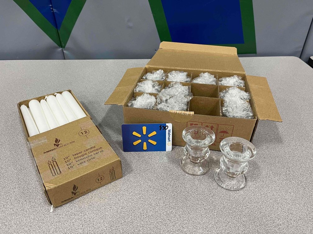 $30 Walmart gift card donated by Walmart with 12 white candles and holders donated by Denise Smith