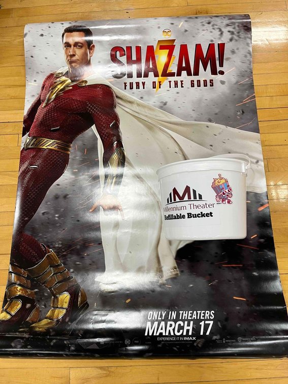 Shazam movie poster and refillable popcorn bucket donated by Millennium Theater
