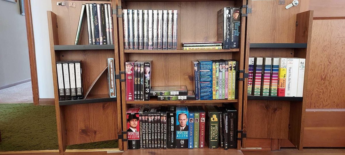 LARGE ASSORTMENT OF DVDS AND VHS TAPES, CABINET NOT INCLUDED