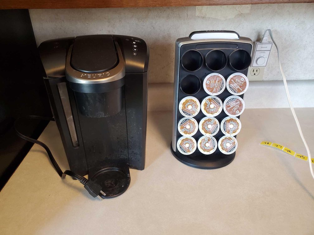 KEURIG COFFEE MACHINE AND A K-CUP HOLDER