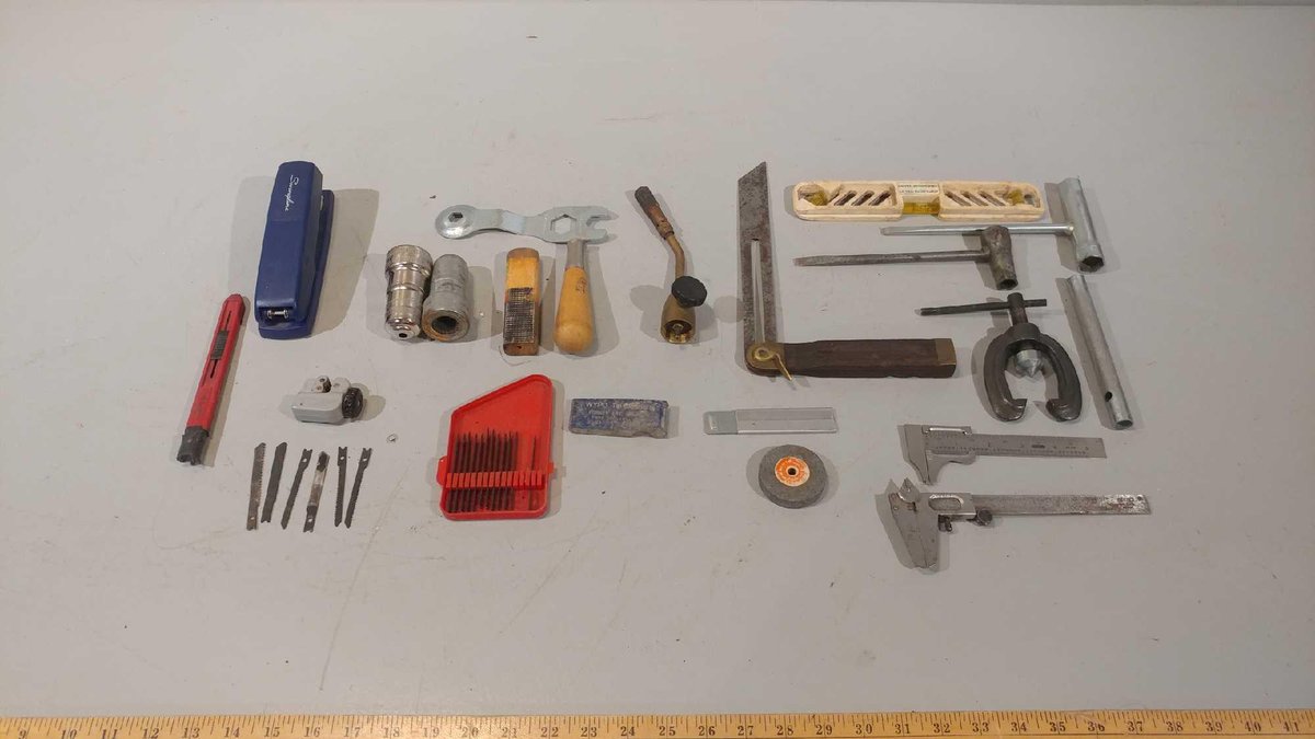 STAPLER, LEVEL, JIGSAW BLADES, AND ASSORTMENT OF OTHER MISC ITEMS