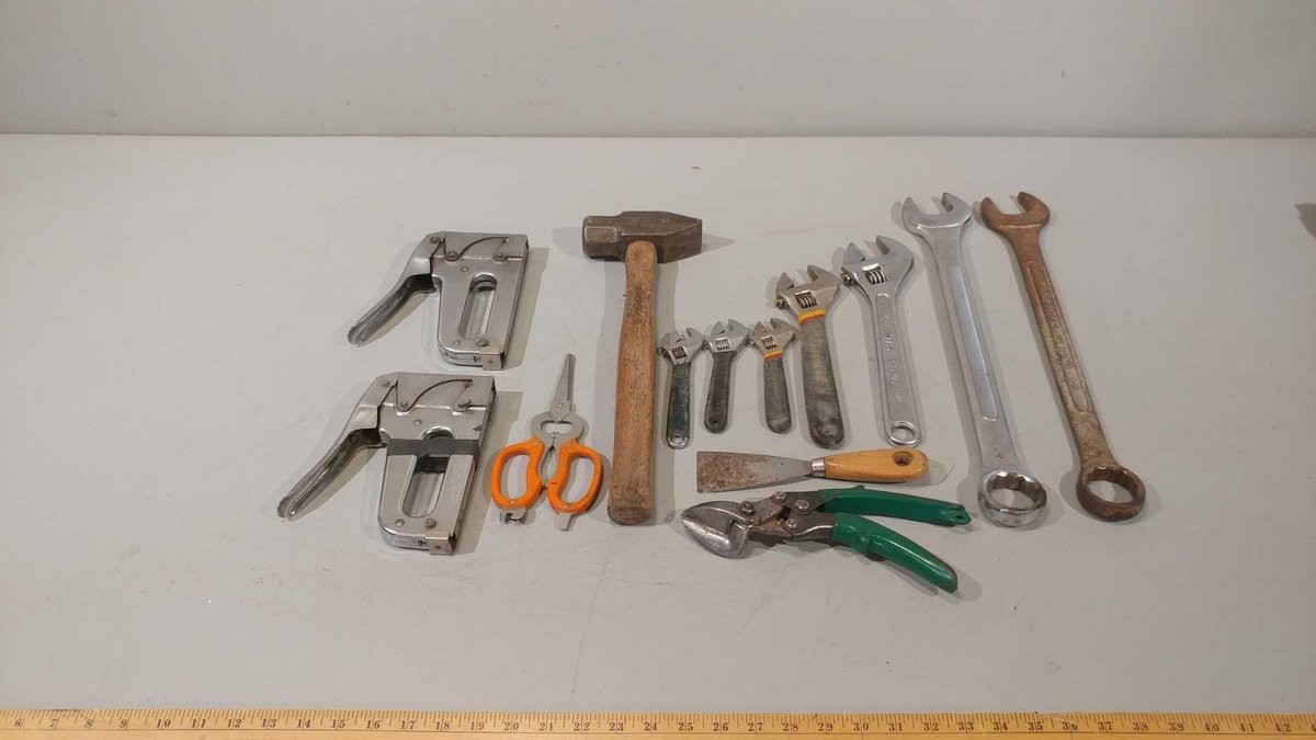 ASSORTMENT OF CRESCENT WRENCHES, COMBINATION WRENCHES, TIN SNIPS, STAPLE GUNS, AND OTHER MISC ITEMS