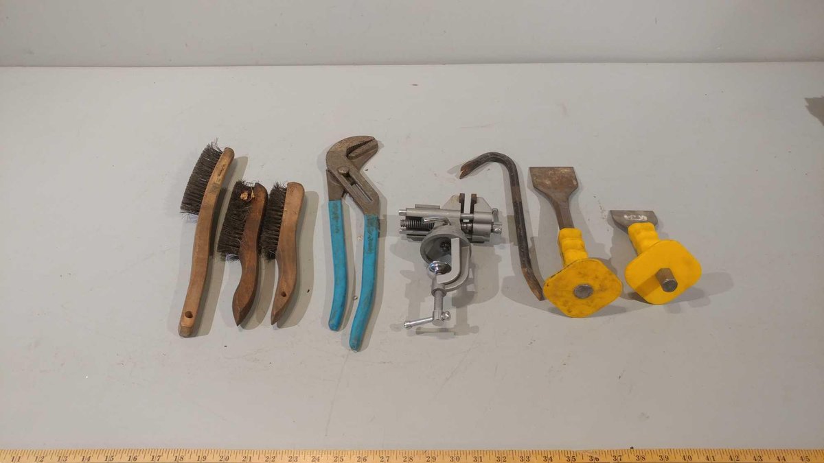 (3) WIRE BRUSHES, BENCH VISE, CHANNEL LOCK PLIERS, (2) CHISELS, AND A PRY BAR