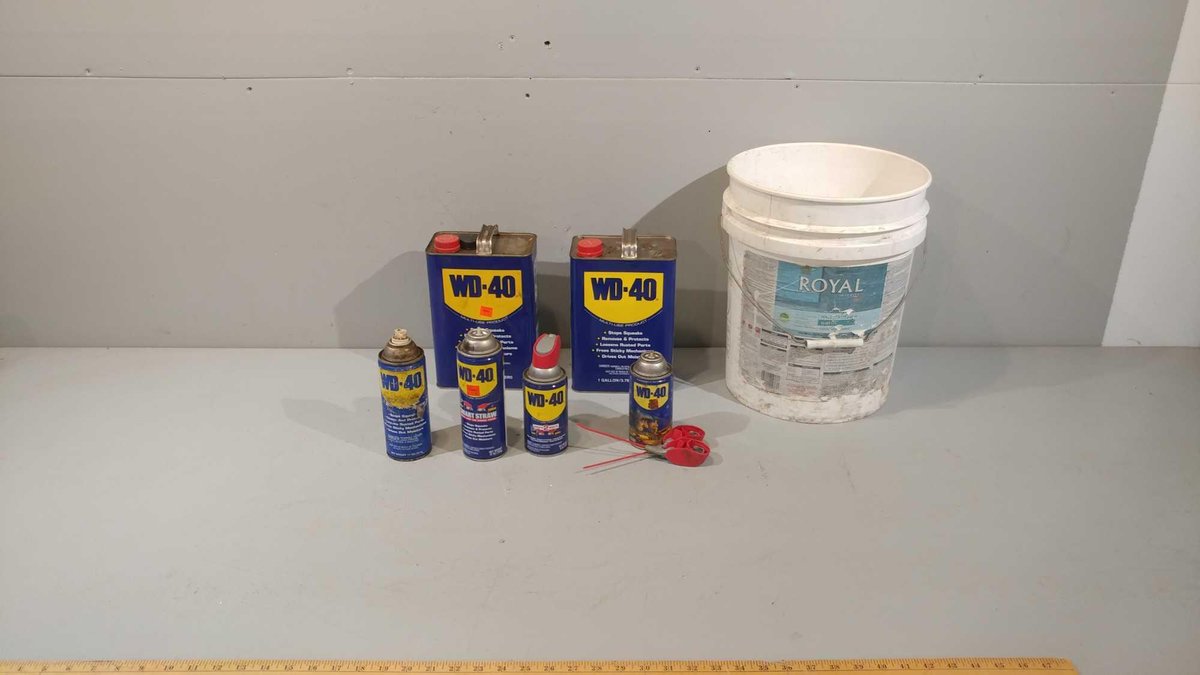 ASSORTMENT OF WD-40 CANS AND CONTAINERS (NEAR EMPTY)