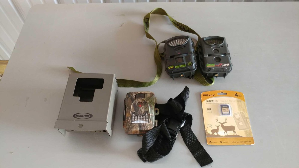 (I-45) (2) PRIMOS WORKHORSE TRAIL CAMS (8 AA BATTERIES) AND A REALTREE TRAIL CAM (4 AA BATTERIES) (U