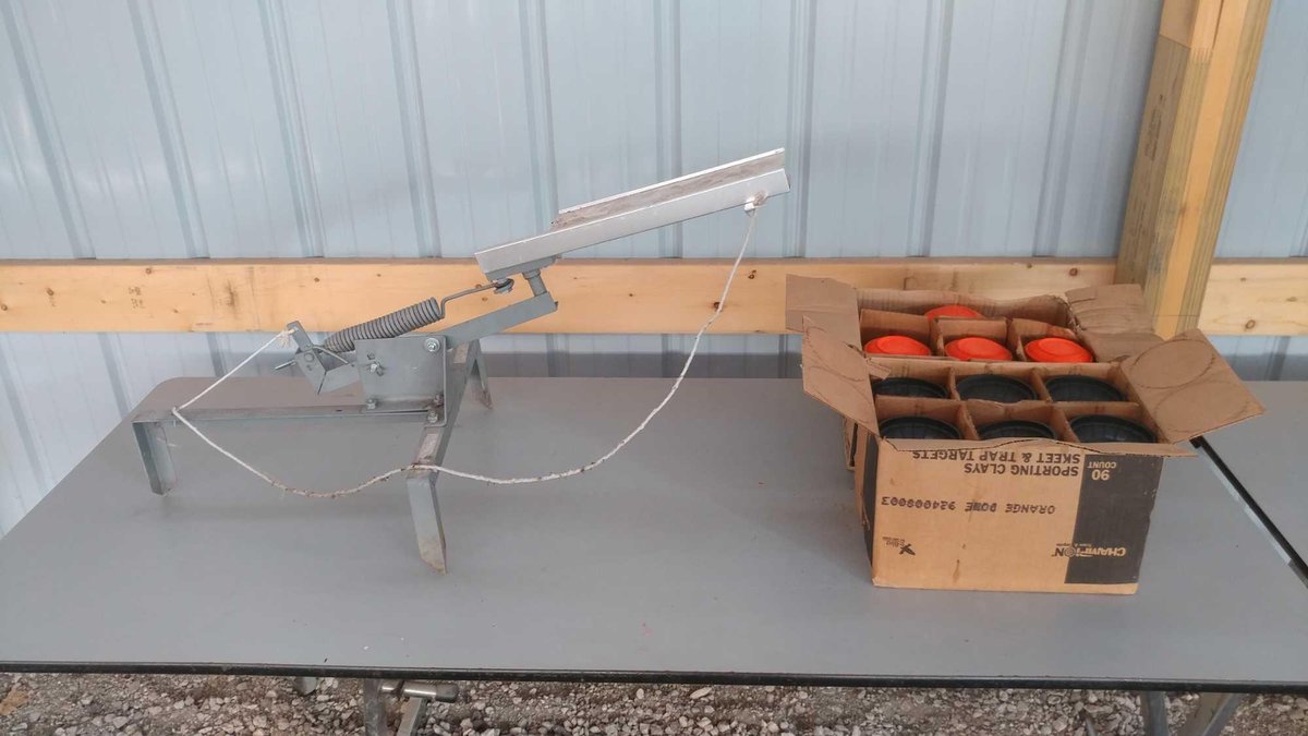 (I-96) (2) BOXES OF CLAY PIGEONS AND A CLAY PIGEON THROWER