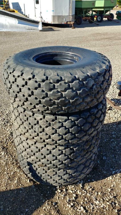 (I-170) (4) FIRESTONE 16.5L - 16.1 TIRES ON 8 BOLT RIMS