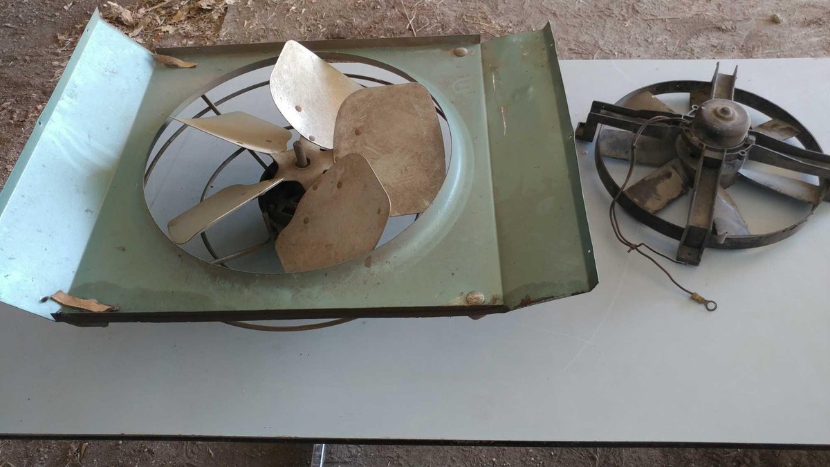 METAL BARN FAN AND A PLASTIC BARN FAN (NEEDS WIRING) (UNKNOWN CONDITION)