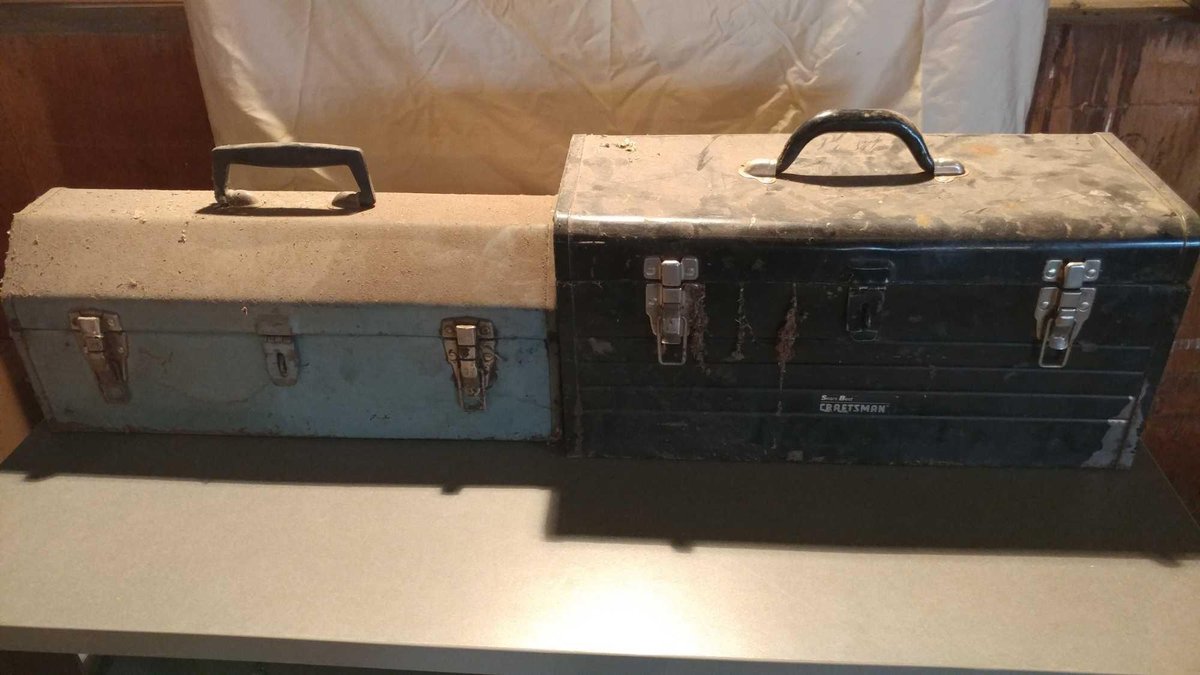 VINTAGE GREEN METAL TOOLBOX AND A BLACK METAL TOOLBOX
