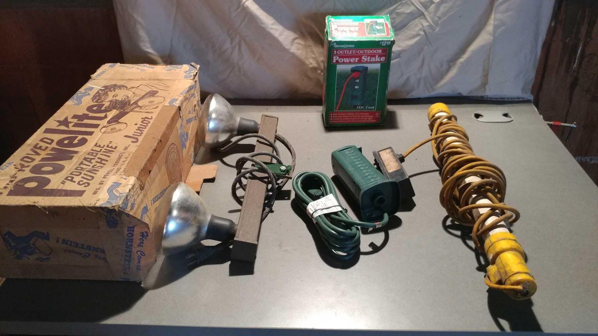 PORTABLE 3-PRONG POWER STAKE OUTLET, PORTABLE WORK LIGHT, AND A POWELITE PORTABLE LIGHT