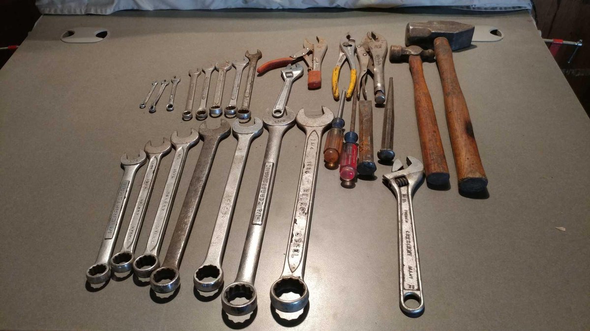 ASSORTMENT OF WRENCHES, CRESCENT WRENCHES, PLIERS, HAMMERS, AND SCREWDRIVERS