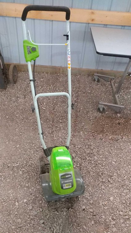 (I-48) GREENWORKS 10" TILLER 40V LITHIUM VMAX (NEEDS BATTERY) AND A BATTERY POLESAW (NEEDS BATTERY)