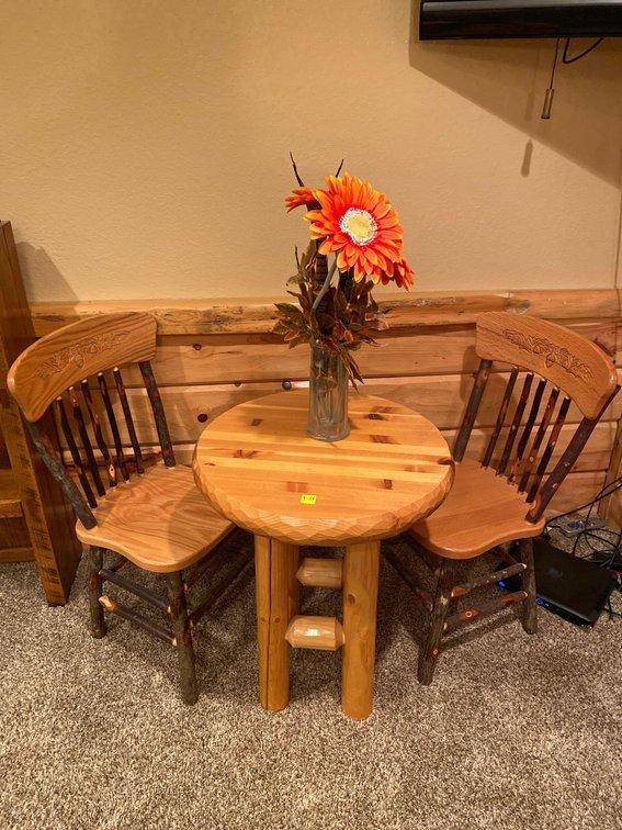  (A1-MANAGER) ROUND TABLE 24" ROUND 30" TALL W/ (2) CHAIRS AND VASE OF FAKE FLOWERS