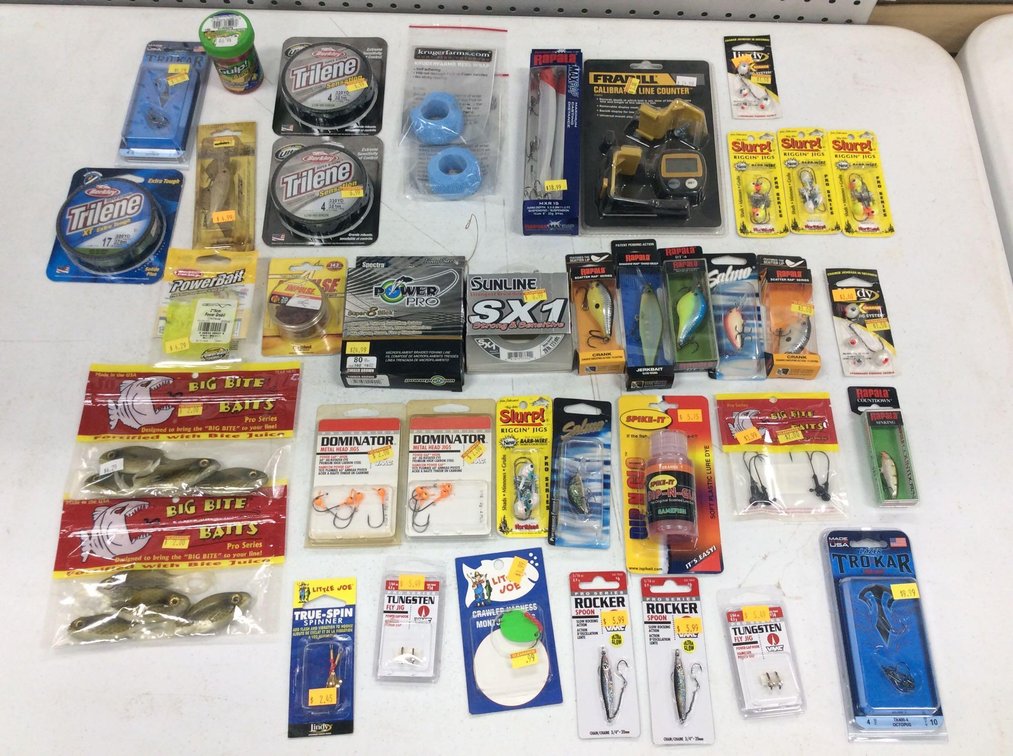 ASSORTMENT OF FISHING LINE, CRANK BAITS, JIGS, PLASTICS, LINE COUNTER, & MISC FISHING ITEMS