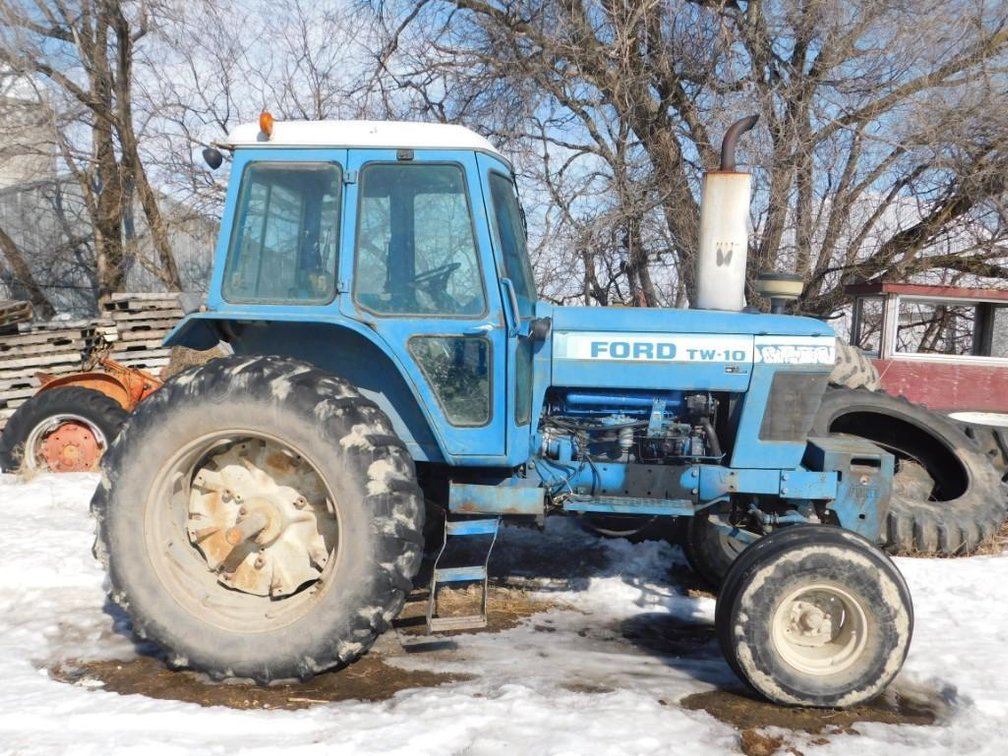 FORD TW-10, 2 WD TRACTOR, 11 FRONT WEIGHTS, 3 HYD, 540 PTO, 3PT, CAB AIR HEAT, NEW RADIATOR 1 YEAR A