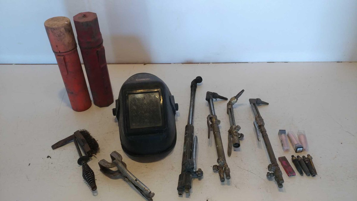 WELDING HELMET, RODS W/CASES, VISE CLAMP, TORCHES AND TORCH HEAD HARDWARE