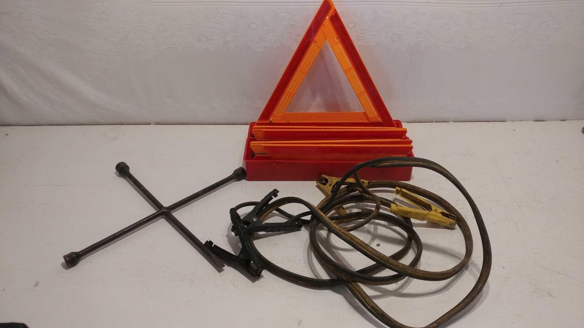 JUMPER CABLES, TIRE IRON, AND (3) EMERGENCY TRIANGLES 