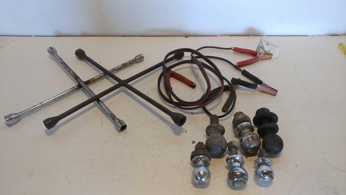 (2) TIRE IRONS, JUMPER CABLES, (3) 2 5/16" BALLS, 2" BALL, AND (2) 1 7/8" BALLS