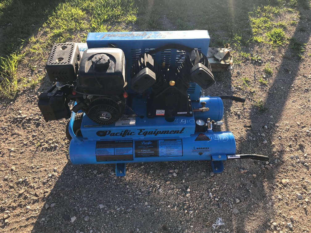 PACIFIC 2-T GAS POWERED PORTABLE AIR COMPRESSOR AND HOSE (ITEM AT ZIELSDORF AUCTIONS)