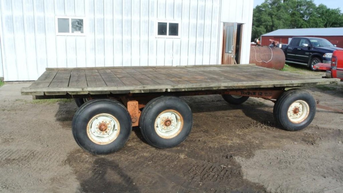 MINNESOTA TANDEM RUNNING GEAR WITH HAY RACK (FOR MORE INFO & LOCATION CALL VIRGIL @ 320-220-0510)