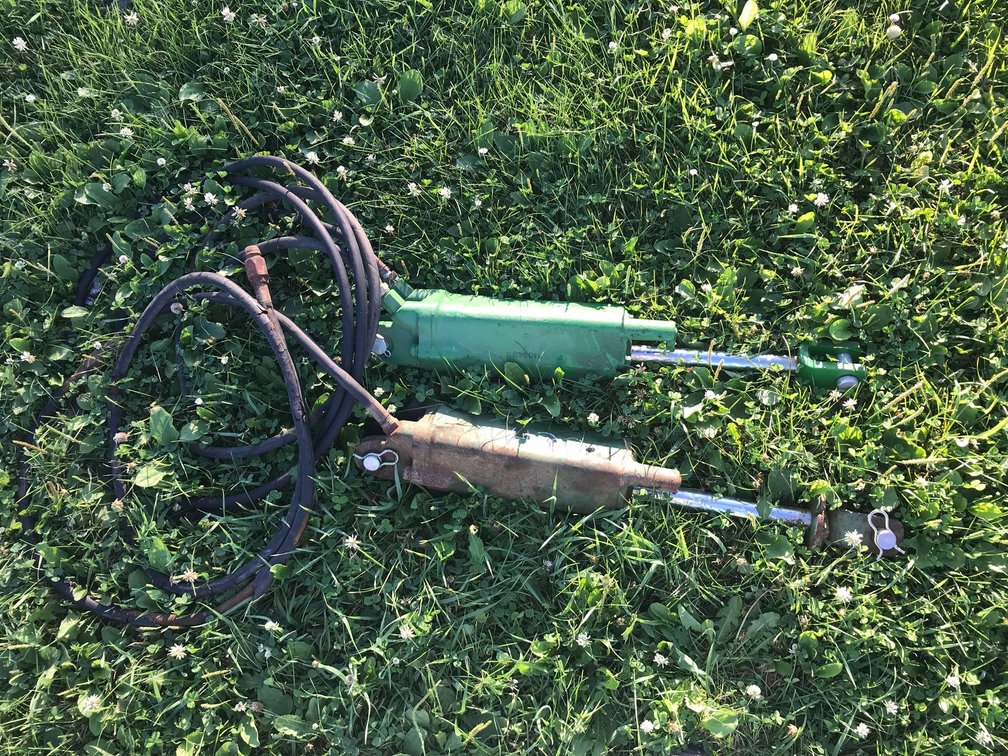 (2) JOHN DEERE CYLINDERS WITH HOSES AND DEPTH STOP (ITEM AT ZIELSDORF AUCTIONS)