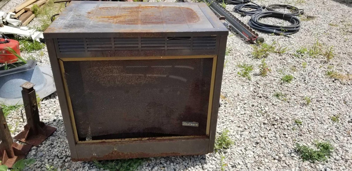 HEAT WAVE WOOD STOVE W/ WITH PIPE AND FLASHING (ITEM AT ZIELSDORF AUCITON)