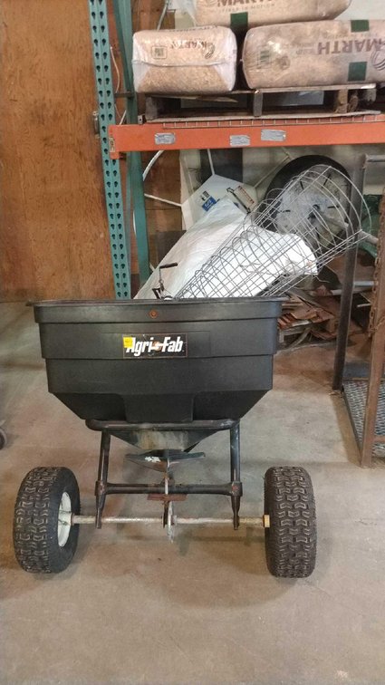 AGRIFAB TOW BEHIND SEED BROADCASTER and (7) TOMATO CAGES