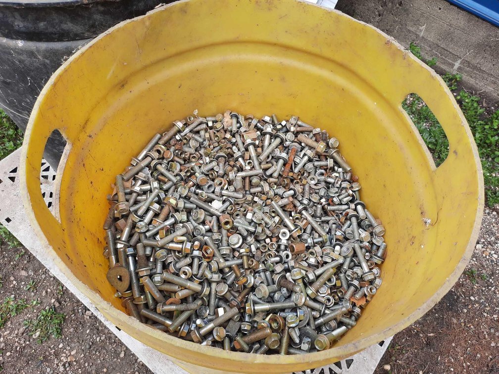 YELLOW BARREL OF MISCELLANEOUS BIN BOLTS