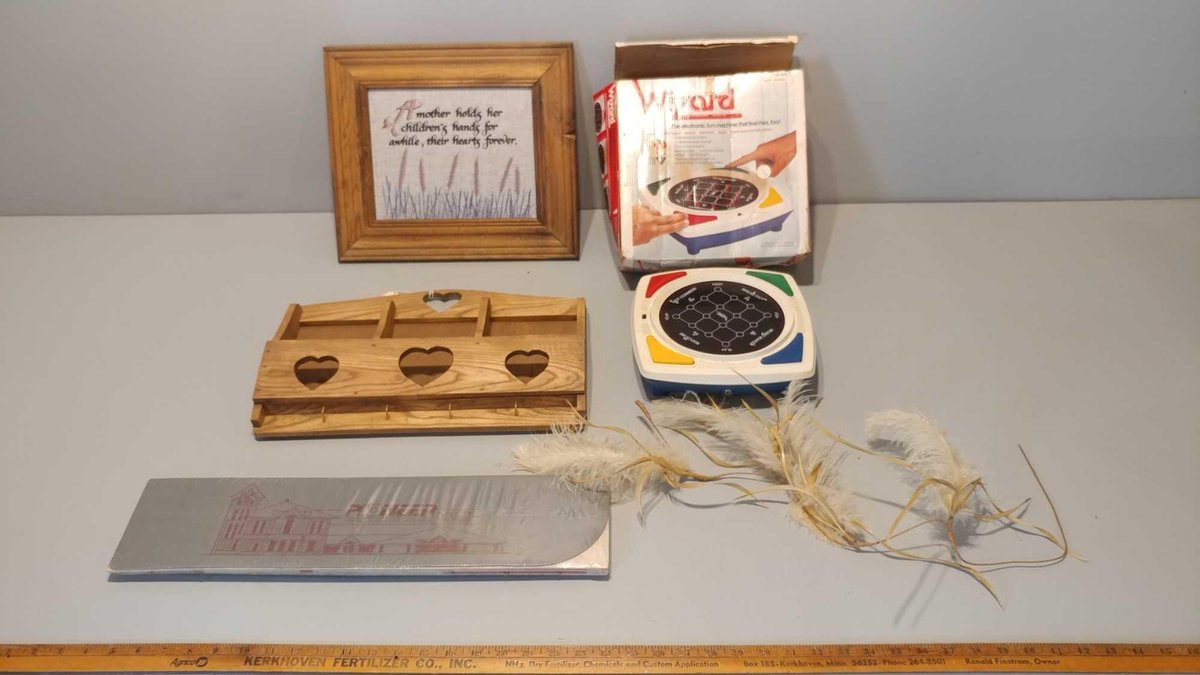 FRAMED NEEDLE POINT SAYING, WOODEN LETTER HOLDER, WIZARD TEACHING MACHINE, FEATHERS, & WINDSHIELD PR