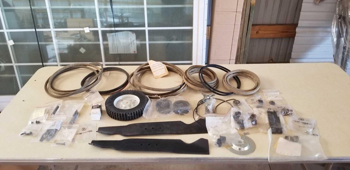 ASSORTMENT OF YARDMAN PARTS, BLADES, BELTS, & WHEELS