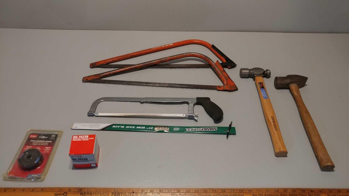 (2) BOW SAWS, HACKSAW, (2) HAMMERS, OIL FILTER, AND TRIMMER SPOOL
