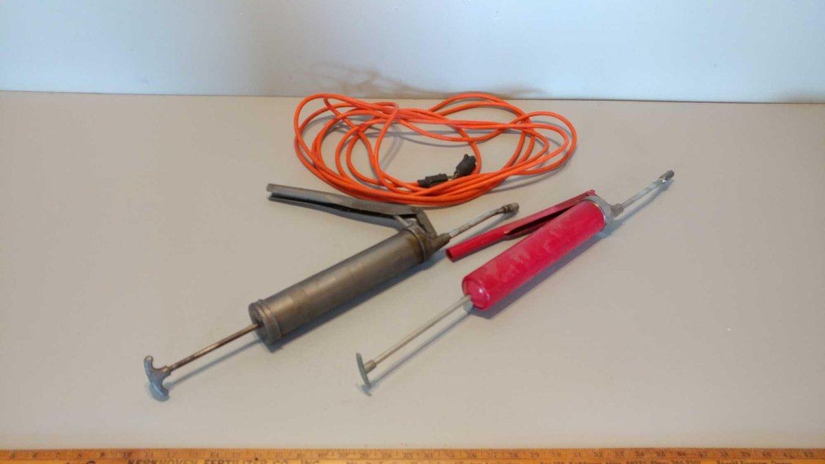 (2) GREASE GUNS, AND ORANGE EXTENSION CORD