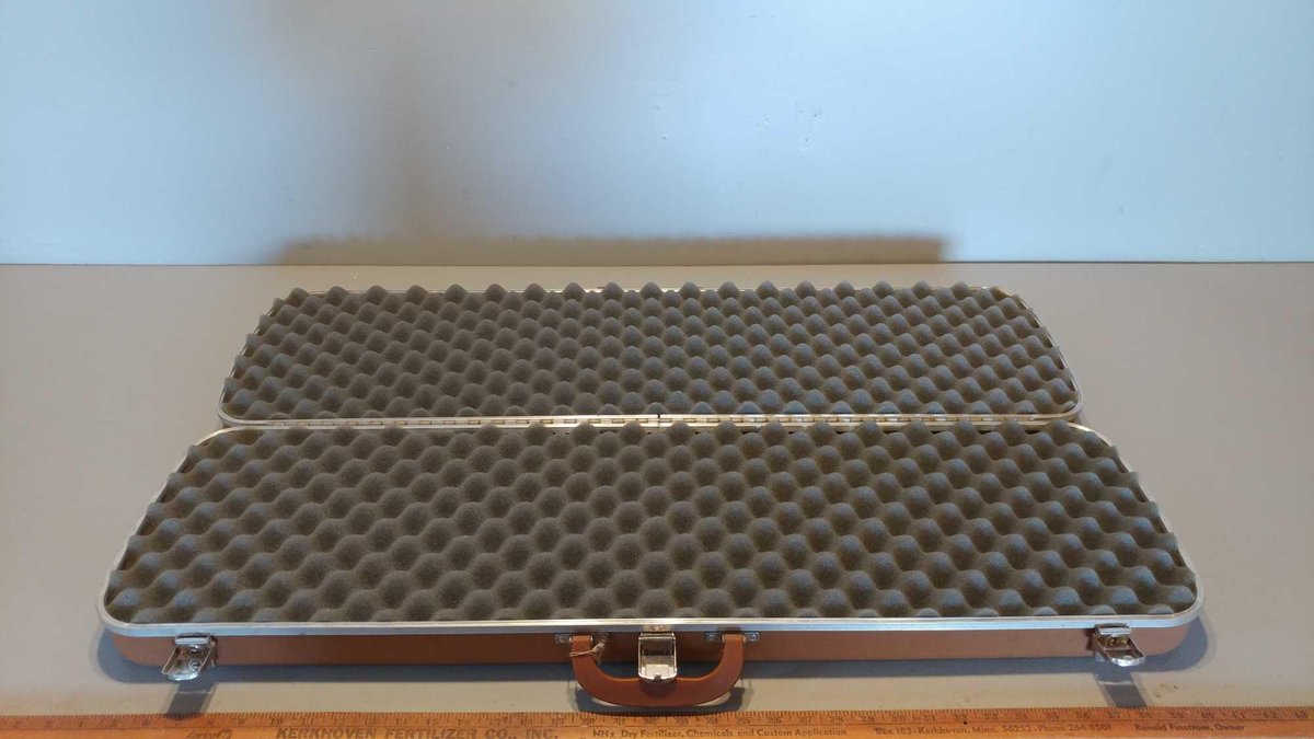 (I-6) BROWN HARD SIDED GUN GUARD GUN CASE (LOCATED AT ZIELSDORF AUCTIONS)